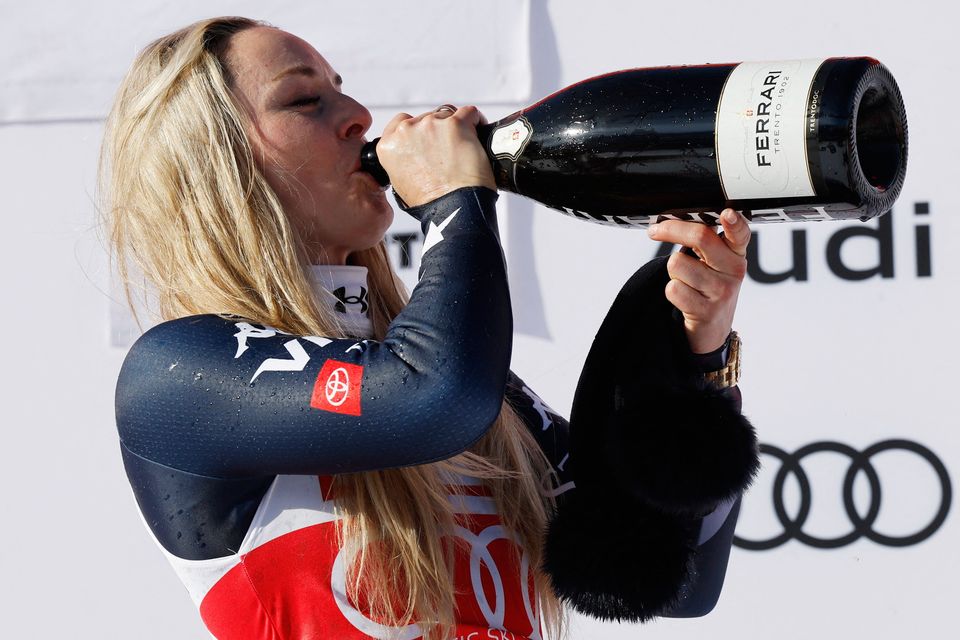 Lindsey Vonn celebrates with champagne. Photo: Reuters/Stefan Wermuth
