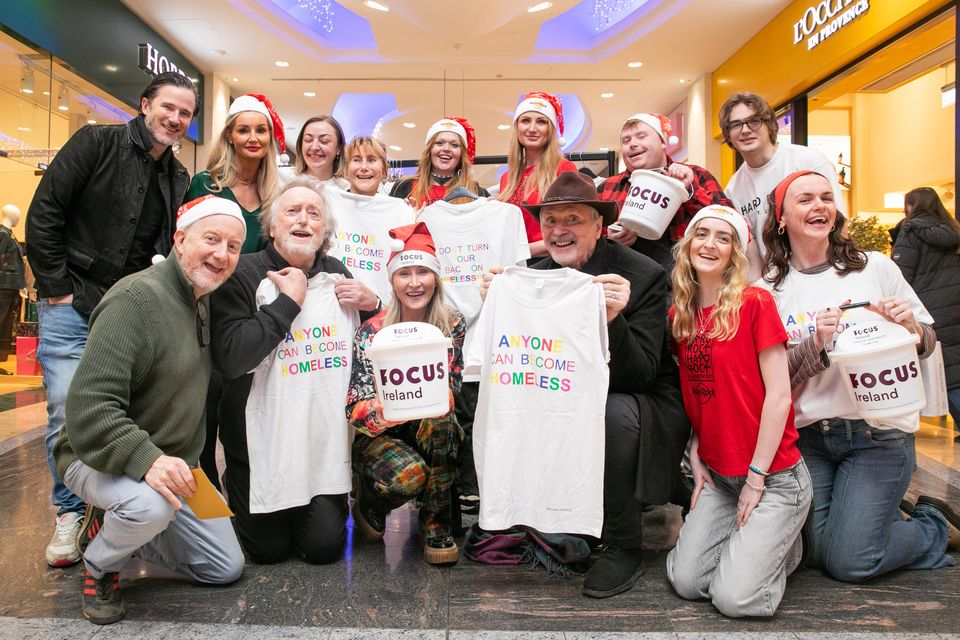 Barry Devlin, designer Helen Steele and actor Patrick Bergin with friends and members of Focus Ireland, selling  T-shirts for Rock Against Homelessness in aid of Focus Ireland at Dundrum Shopping Centre, Dublin. Photo: Gareth Chaney
