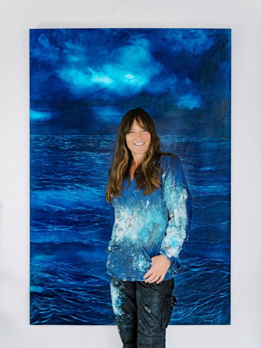 Carol Cronin with one of her paintings.