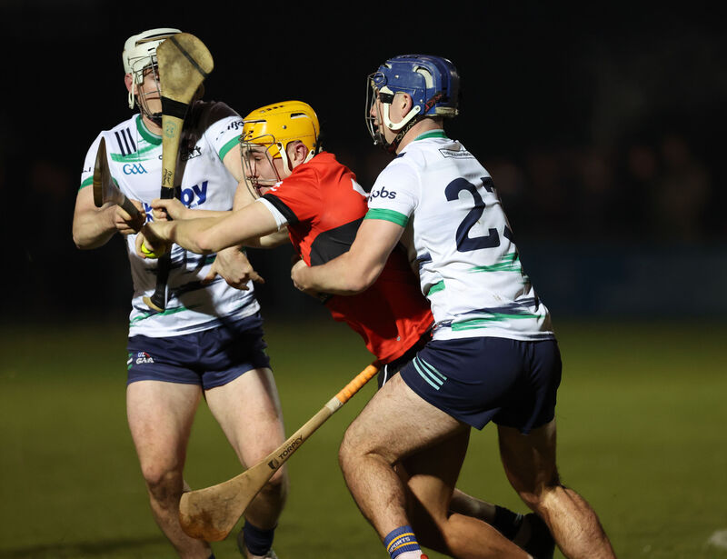  Peter McGarry, UCC, battles with Anthony Keady and Chris Thomas, UL. Picture: Jim Coughlan.