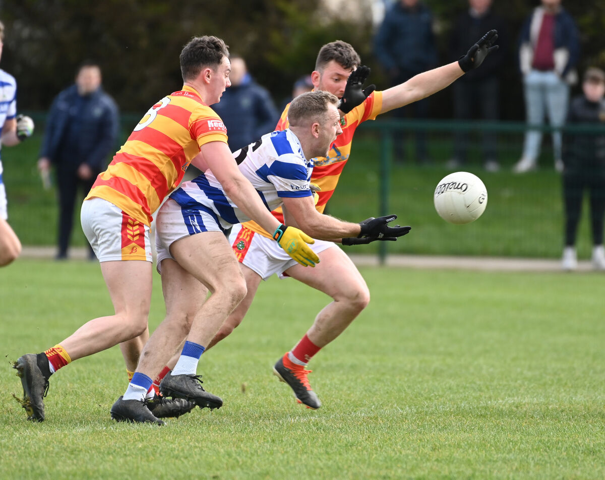 Castlehaven's Michael Hurley is tackled by Newcestown's Eoghan Collins and James Kelleher during the McCarthy Insurance Group SFL Division 1 game at Newcestown this year. Picture: Eddie O'Hare