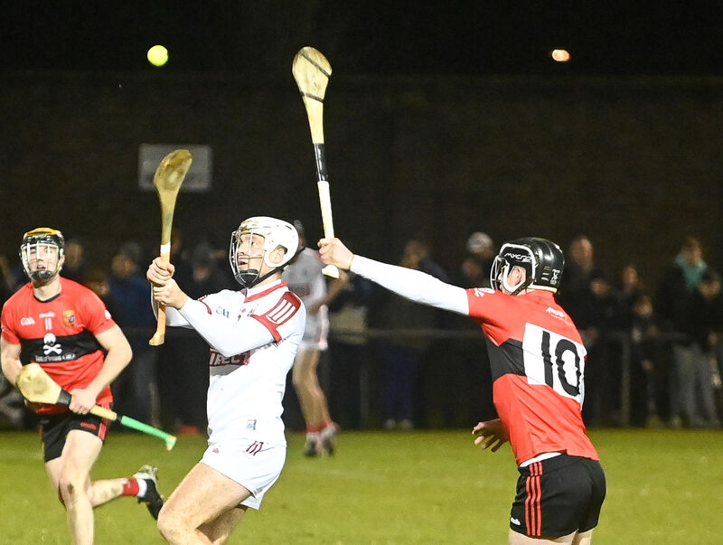  Cork's Luke Meade gets his pass away under pressure from UCC's Conor Cahalane during the Canon O'Brien Cup clash at the Mardyke in January 2023. Picture: David Keane