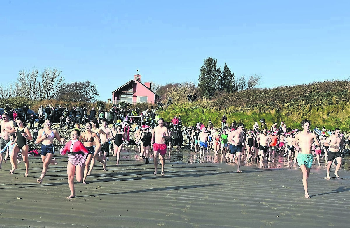 Dozens of hardy souls racing to the water for the Golden Jubilee Christmas Day Swim at Broadstrand, Courtmacsherry, West Cork. They were raising funds for the Paediatric Cystic Fibrosis Unit at Cork University Hospital and Horizons Cork (Cope Foundation) which support adults and children with intellectual disabilities. 	Picture: Martin Walsh
                    