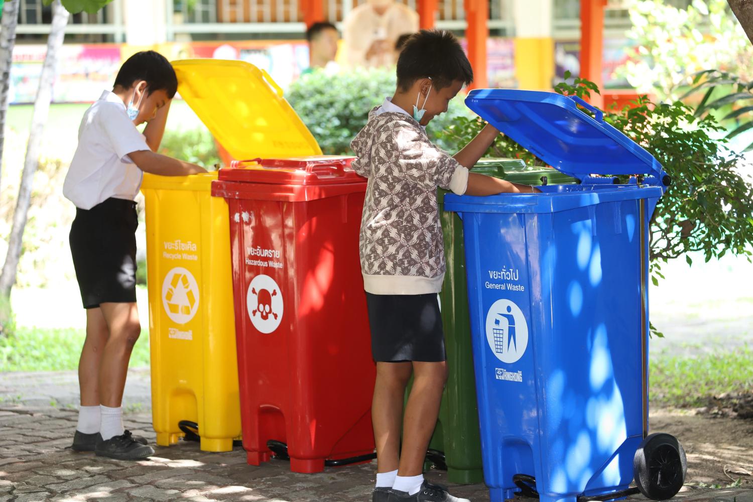 Students at a school in Bangkok are encouraged to separate garbage for recycling. Varuth Hirunyatheb