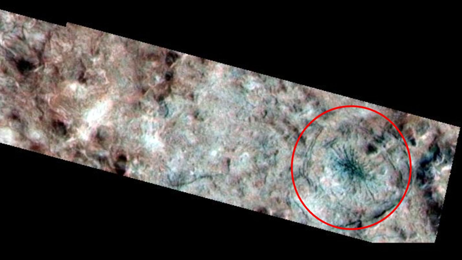 A photo of Europa's surface with a red ring around the spider-like feature