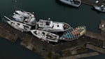 A group of abandoned and derelict boats  at a marina in Newport, Ore., on March 31, 2025.
