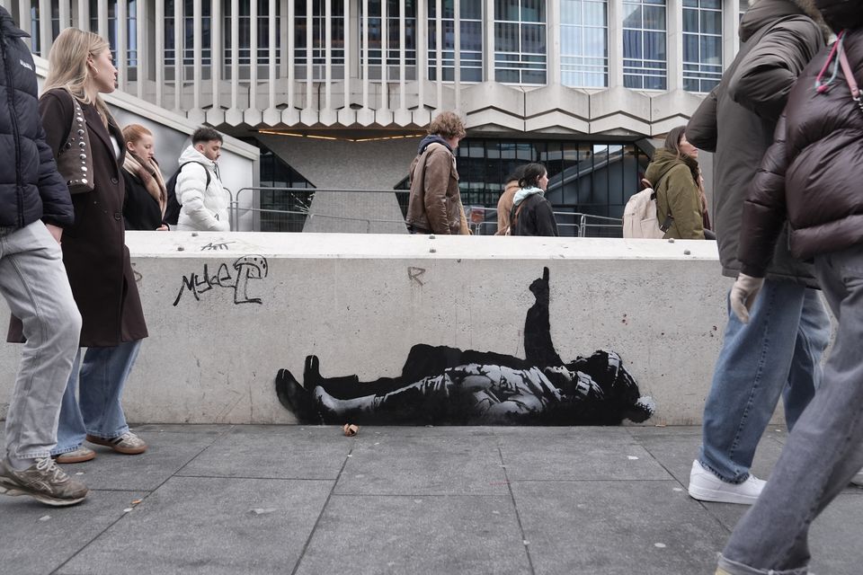 The artwork appeared beneath the Centre Point building near Tottenham Court Road in central London on Monday (Stefan Rousseau/PA)