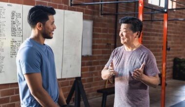 Two men talking in gym setting