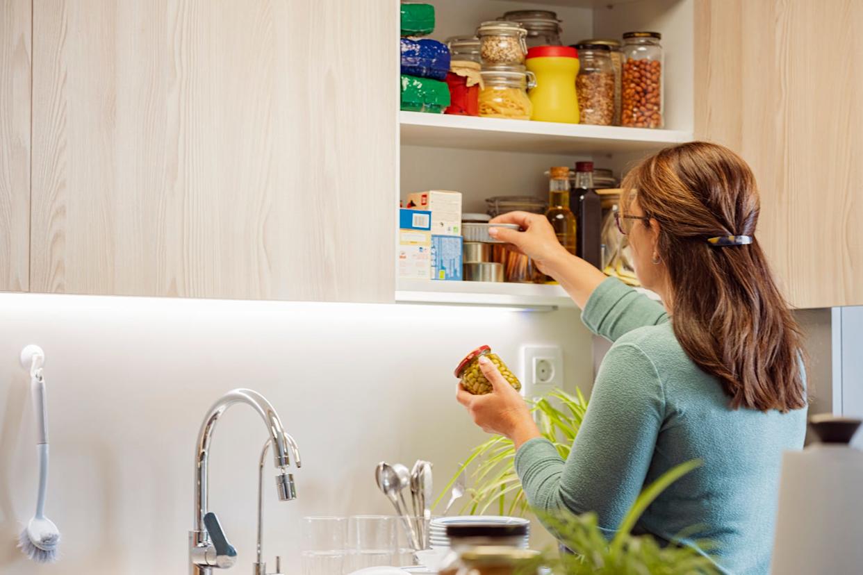 woman arranging pantry food