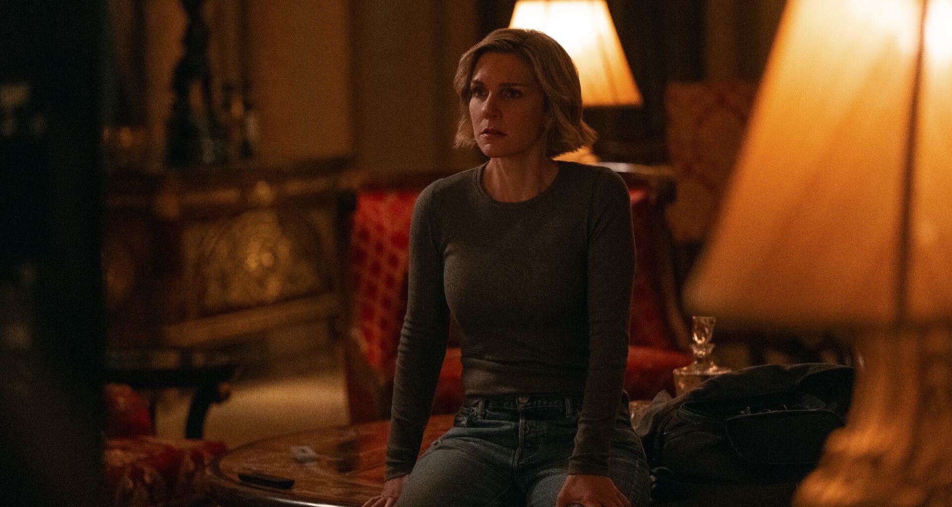 Carol (Rhea Seehorn) sitting down in Pluribus