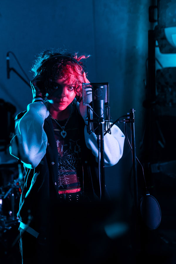 Addy Faith holds her headphones after signing. | Photo courtesy of Brandt Moon.