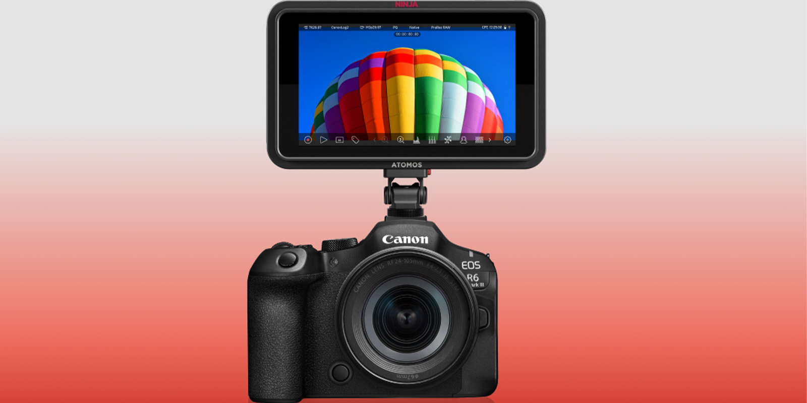 A Canon EOS R6 Mk III camera with a large Atomos Ninja external monitor, capable of ProRes RAW recording, displays a photo of a colourful hot air balloon against a blue sky on a red-to-white gradient background.