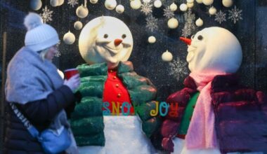 A woman bundled up against the cold weather as she passes the Arnott's Christmas window display on Henry Street in Dublin City Centre in 2022.