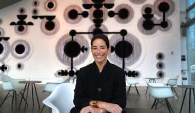 Nora Burnett Abrams is the Institute of Contemporary Art’s new director. She sits in the lobby in front of an installation by Caroline Monnet called "Man-made Land."