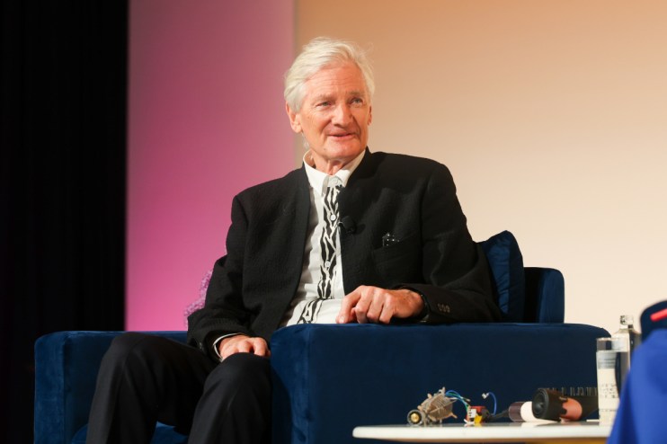 James Dyson discussing inheritance tax reforms at a business conference podium, emphasizing economic impacts.