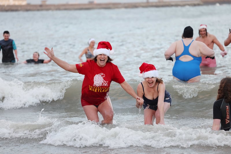 Amy Alperin (left) and Shannon Levine make a splash in Sandtcove. Photograph: Bryan O’Brien
