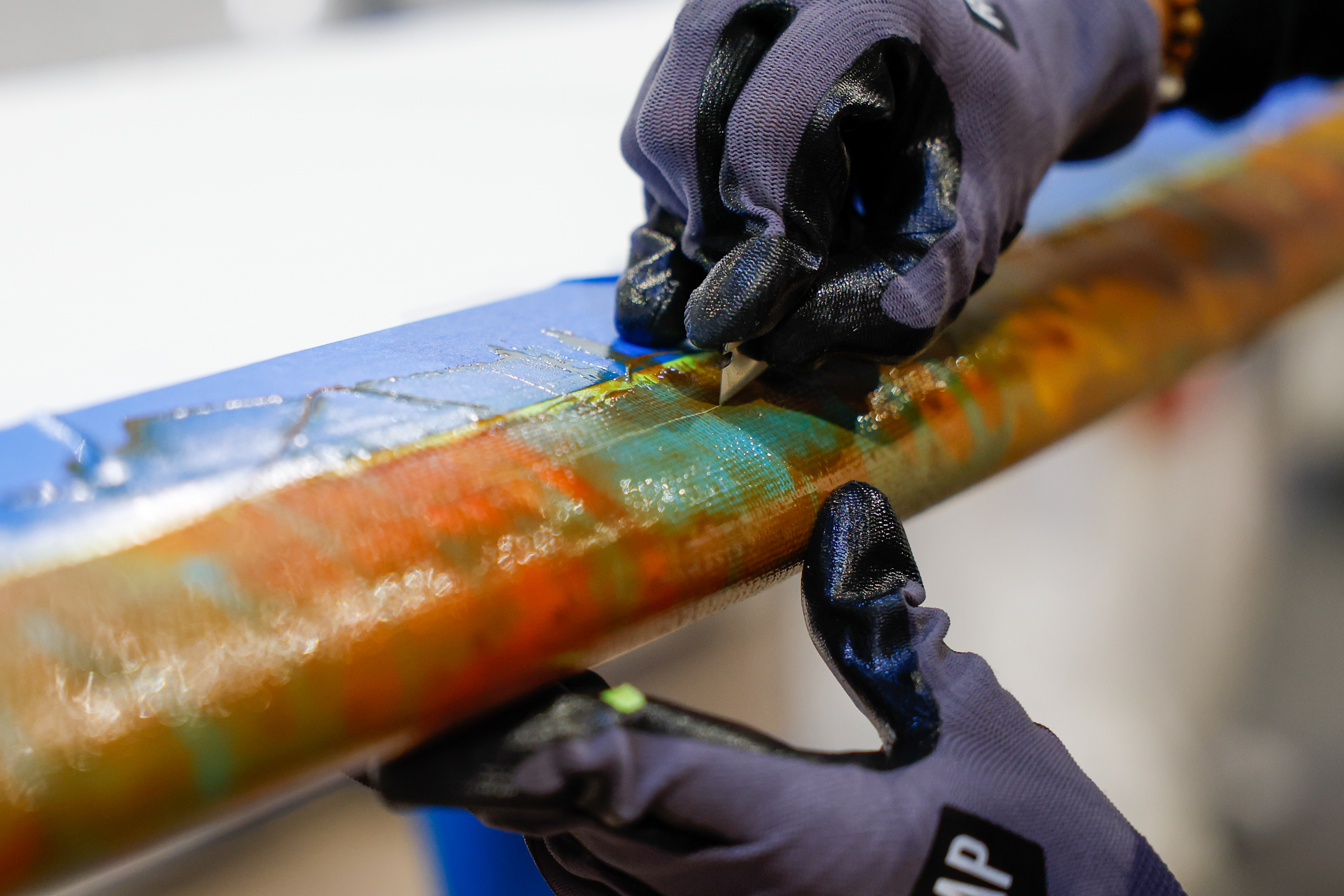 Liesbeth Van Hassel works on a board at Swellcycle headquarters...