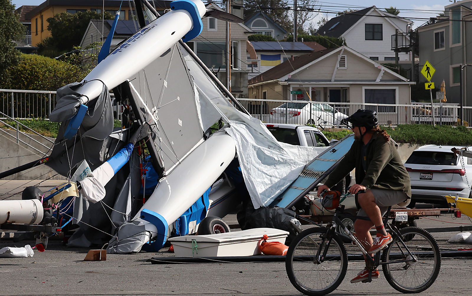 A catamaran sits on its side Thursday morning in a...