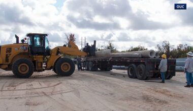 OUC crews load up concrete utility poles that will be used to help construct an artificial reef. (Spectrum News)