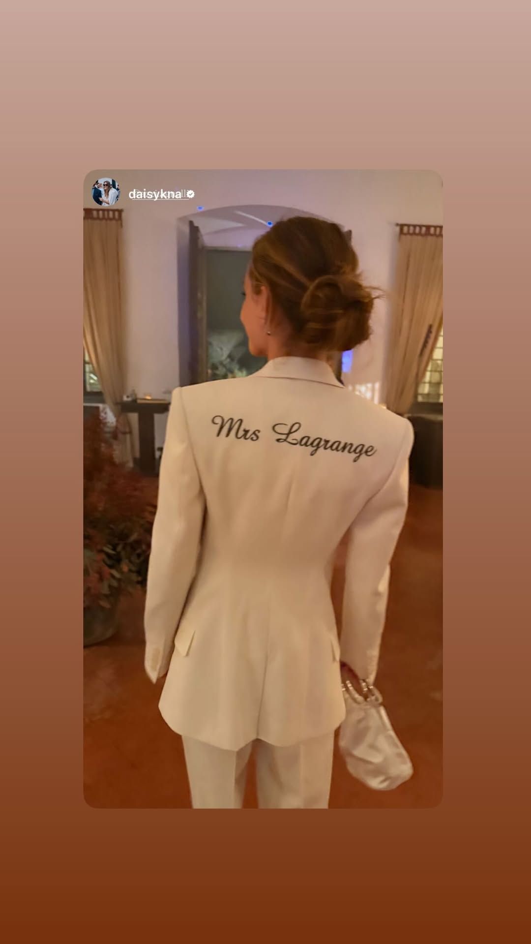 Image may contain Adult Person Head Face Formal Wear Happy and Smile