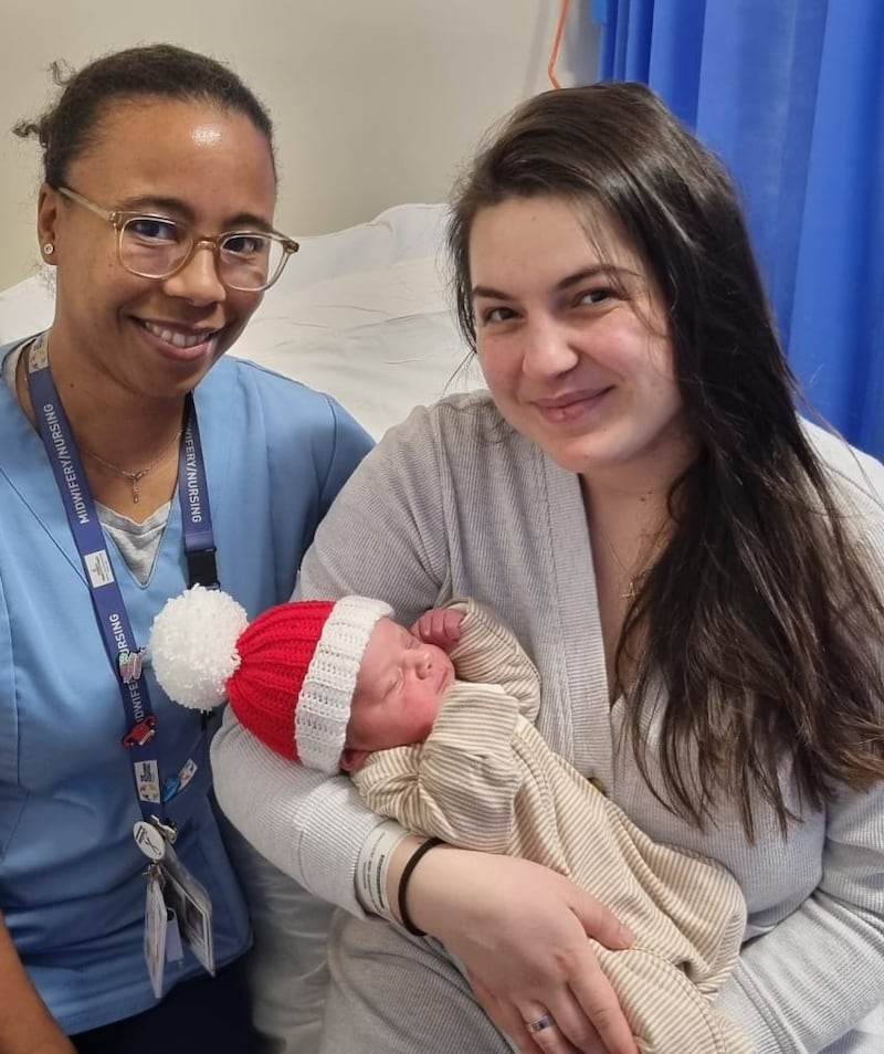 Baby David with his mother Natalia Simciuc and midwife Elsie Cotterill at the Rotunda Hospital