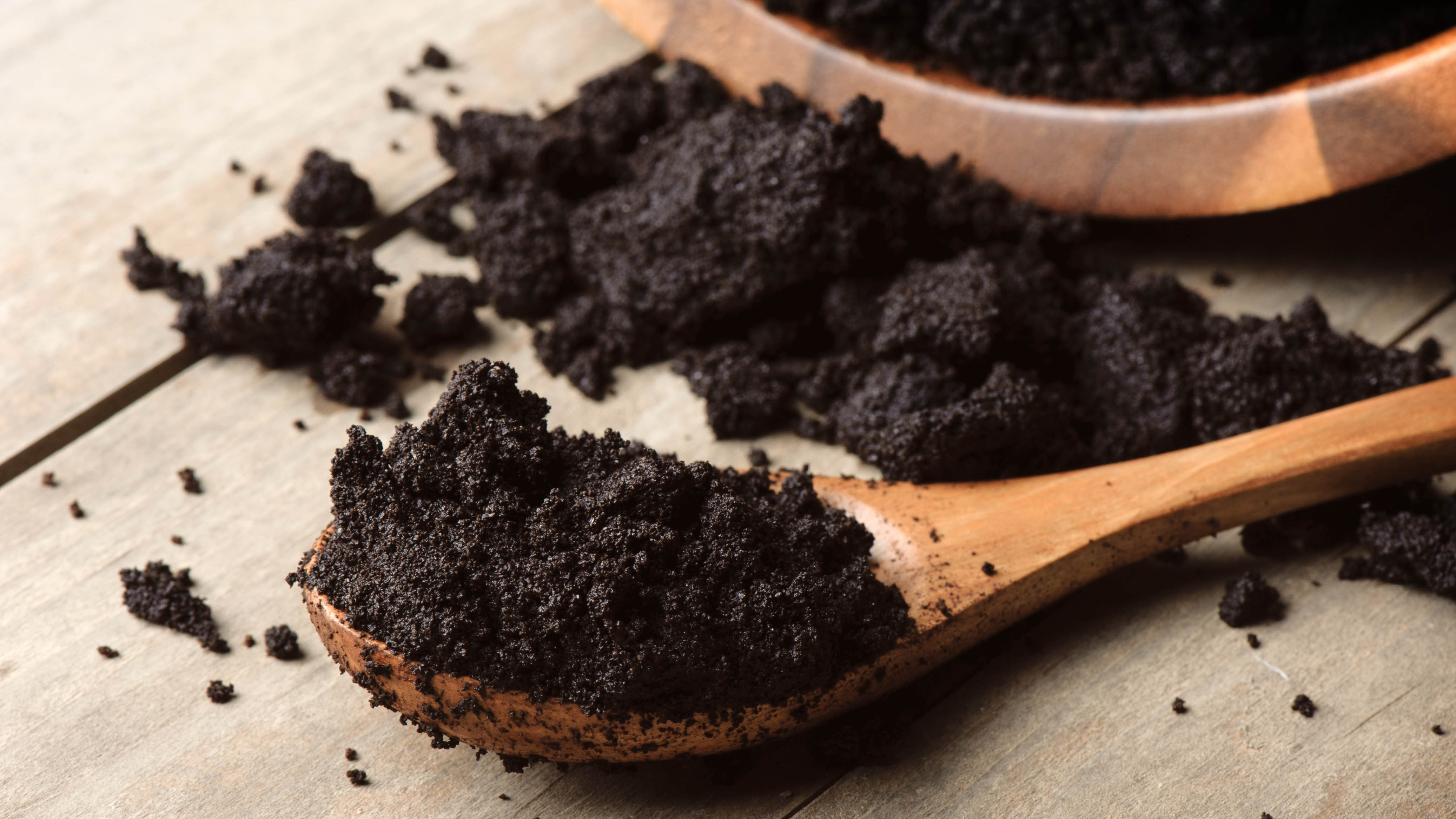 Spoon of used coffee grounds