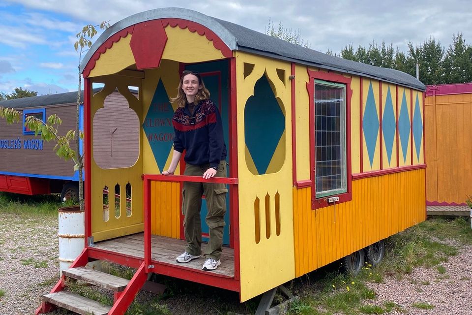 Fionnuala outside the colourful ‘The Clown’ wagon at The Grand Circus Hotel