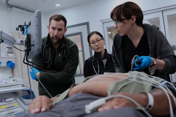 Noah Wyle, Irene Choi and Fiona Dourif in The Pitt.