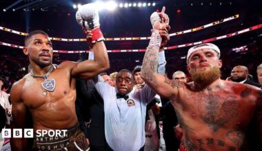Anthony Joshua and Jake Paul have their hand raised