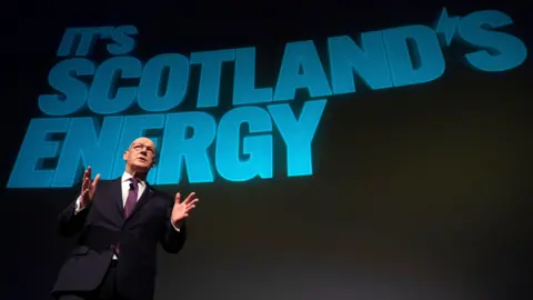 PA Media John Swinney speaking at a Scottish independence campaign event at the Glasgow Science Centre IMAX Theatre.