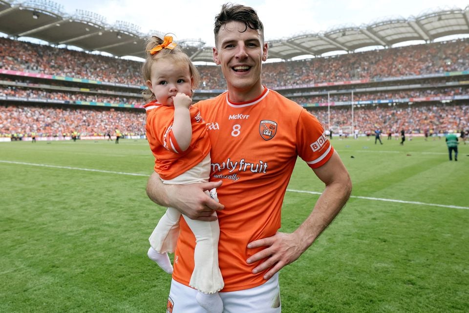 Niall Grimley with daughter Olivia, following Armagh's victory over Galway in the All-Ireland GAA Senior Football Final, 2024. Photo: Laszlo Geczo/INPHO