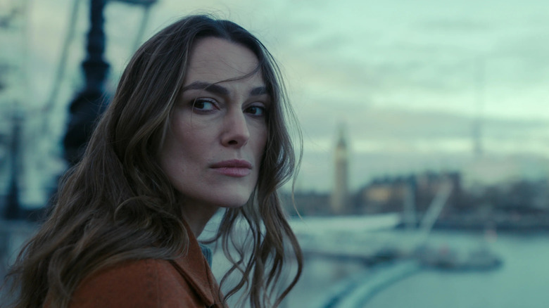 Helen Webb (Keira Knightley) looks away from the River Thames in Black Doves