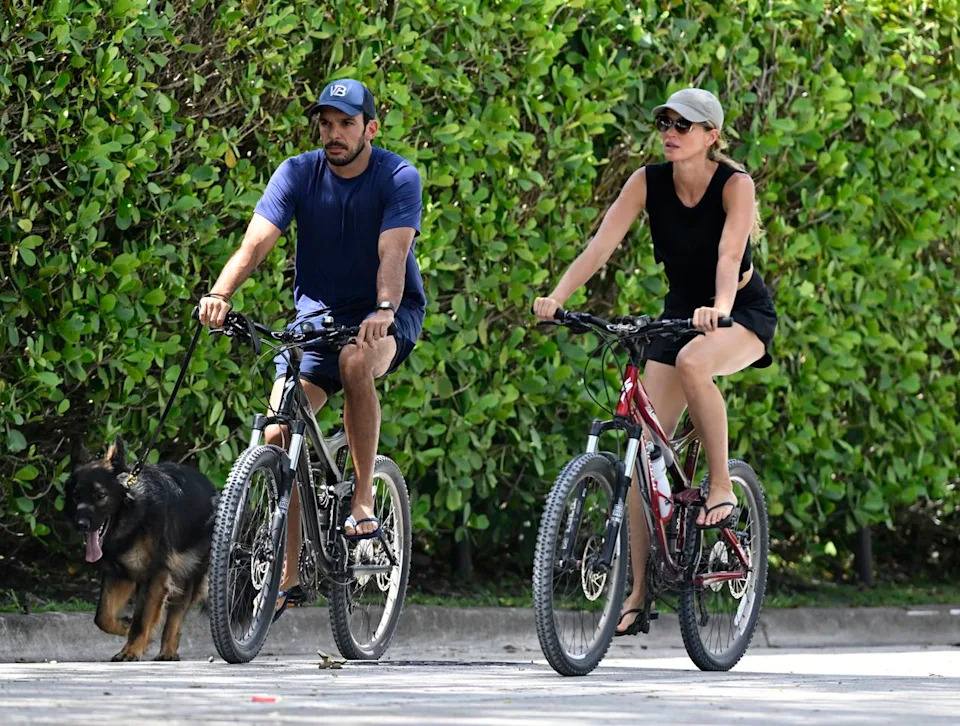 Getty Images Joaquim Valente and Gisele Bundchen are seen on a bike ride on July 14, 2024 in Surfside, Florida