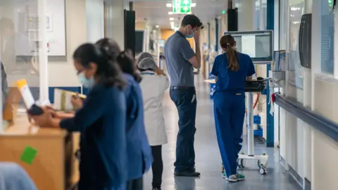 PA Media General view of staff on a NHS hospital ward