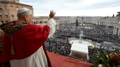 Reuters Pope Leo XIV gestures as he delivers the traditional Christmas Day Urbi et Orbi speech to the city and the world from the main balcony of St Peter's Basilica at the Vatican, 25 December