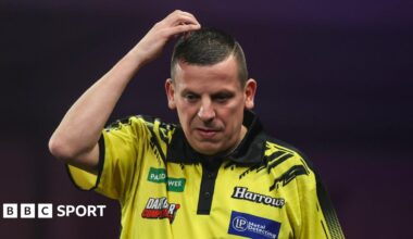 Dave Chisnall looks on