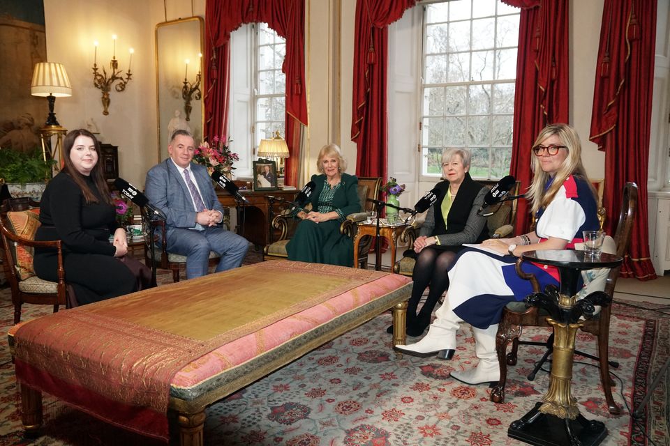 Queen Camilla (centre) with (left to right) Amy Hunt, John Hunt, former prime minister Baroness May and Emma Barnett in the Garden Room of Clarence House (Neil Paton/Buckingham Palace/PA)