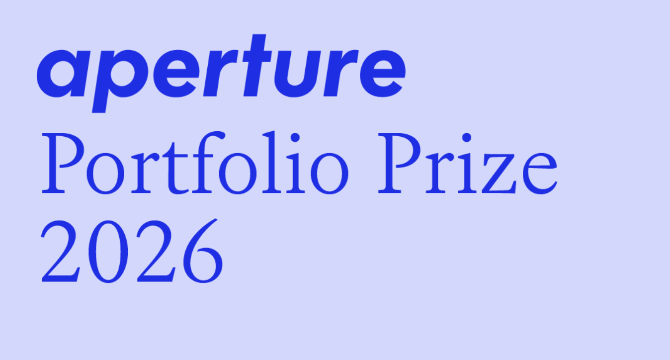 A graphic with blue text on a light blue-lavender background reading "aperture Portfolio Prize 2026."