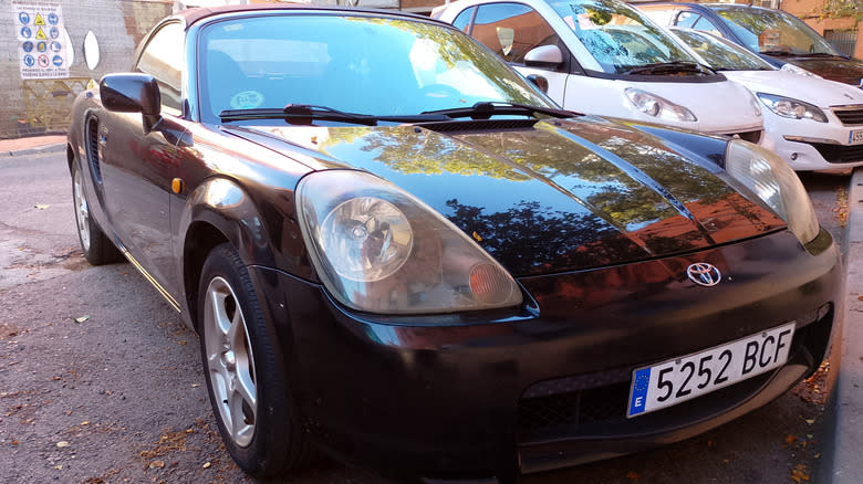 A Toyota MR2 Spyder parked outside
