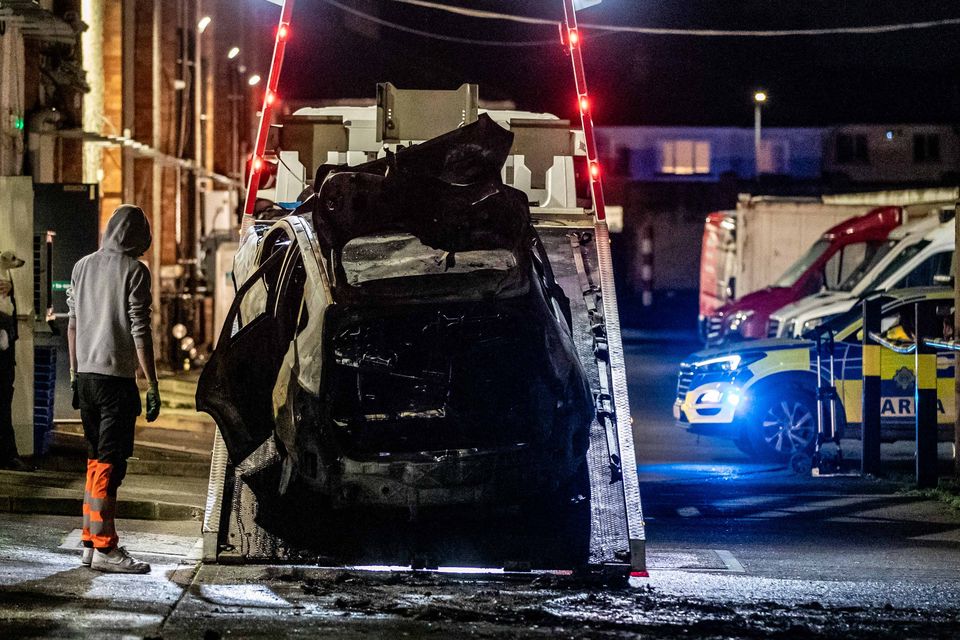 12/12/25 – A burnt-out car is taken away from behind Lucan Shopping Centre after an incident on Friday afternoon. Gardaí investigated the scene. Photo: Damien Storan.