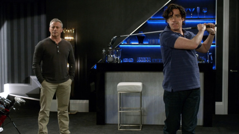 Sean Lincoln (Stephen Mangan) playing virtual golf with Matt LeBlanc in Episodes