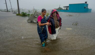 People walk through a flood-affected area amid rainfall due to Cyclone Ditwah in Chennai in December 2025 (Photo: PTI)People walk through a flood-affected area amid rainfall due to Cyclone Ditwah in Chennai in December 2025 (Photo: PTI)