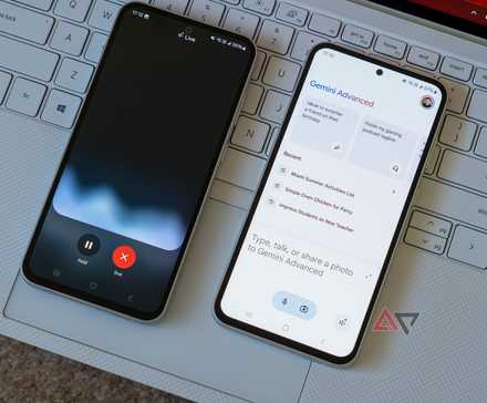 two phones running google gemini app and gemini live on a laptop keyboard