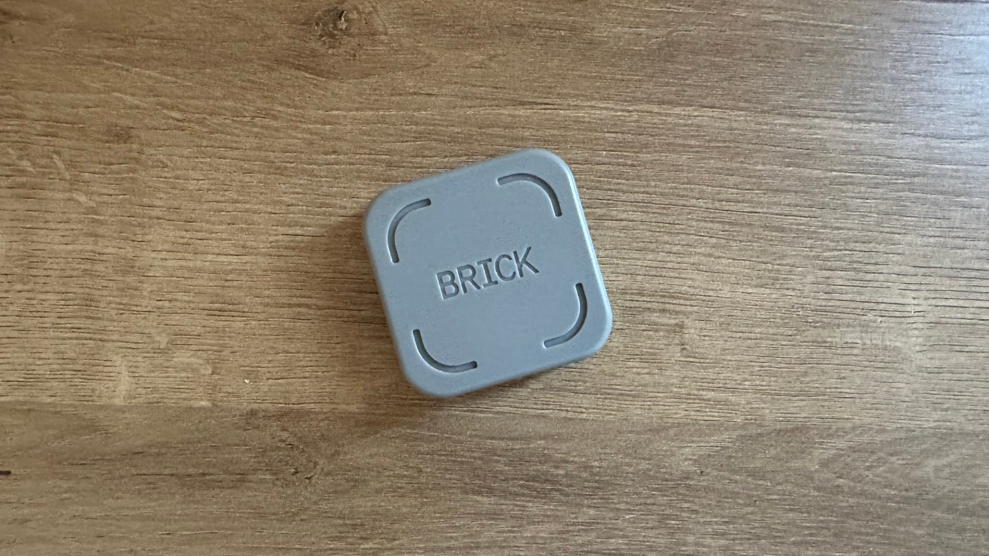 The Brick on a wooden table.