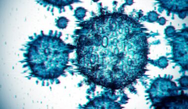 Computer illustration of a digitized virus cells. The round shells have short spikes coming out of them and they look pixelated and artificial.