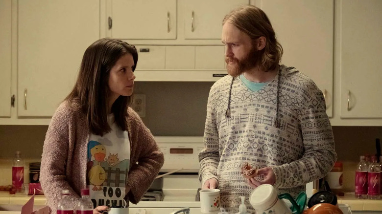 Liz Dudley (Sonya Cassidy) glares at Dud Dudley (Wyatt Russell) in a kitchen in Lodge 49
