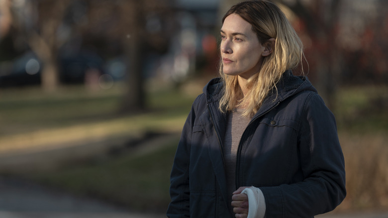 Mare Sheehan (Kate Winslet) in a field on Mare of Easttown