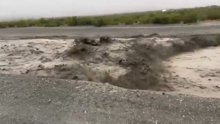 Water rolls down a road in California due to an atmospheric river storm. Pic: CALFIREBDU
