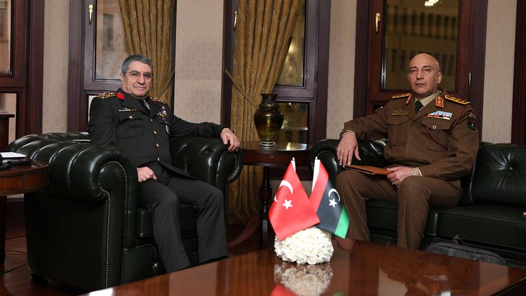 Turkey's Selcuk Bayraktaroglu (left) with General Haddad on Tuesday. Pic: AP