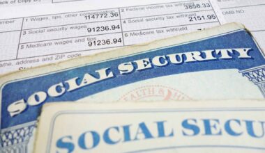 Social Security card on a tax form; image to illustrate COLA 2026 and its impact on payments.